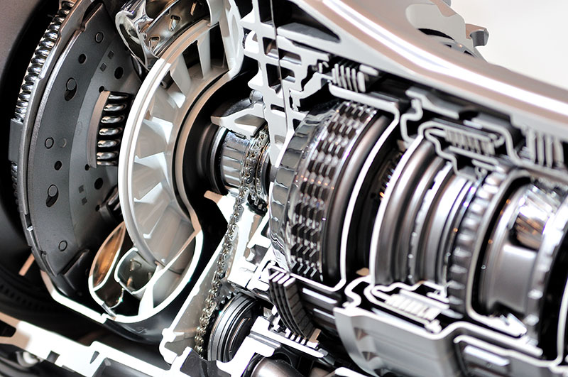 Mobile mechanic in Albuquerque diagnosing a car's clutch and transmission on-site
