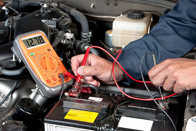 Mobile mechanic in Albuquerque inspecting a used car for hidden issues during a pre-purchase inspection
